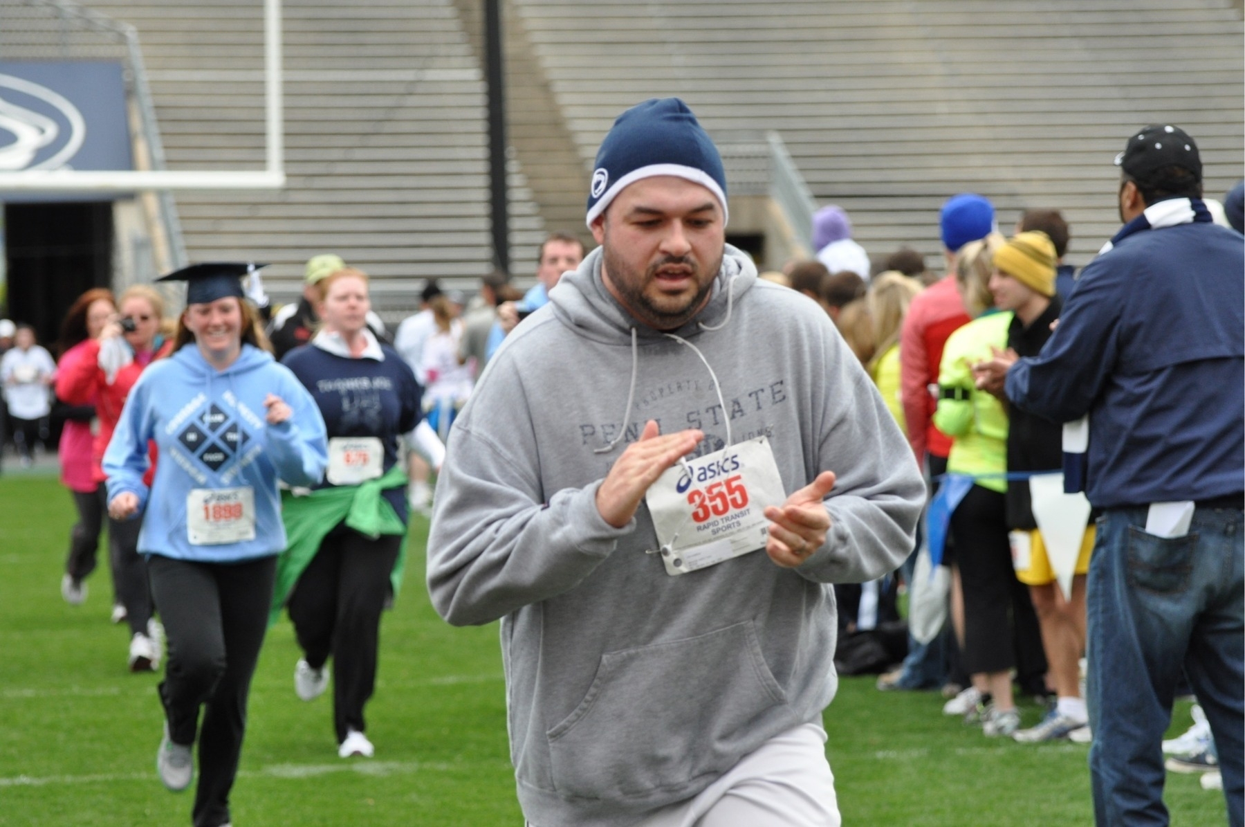 Me, finishing the 2012 Beaver Stadium Run with Franco Harris in the background.